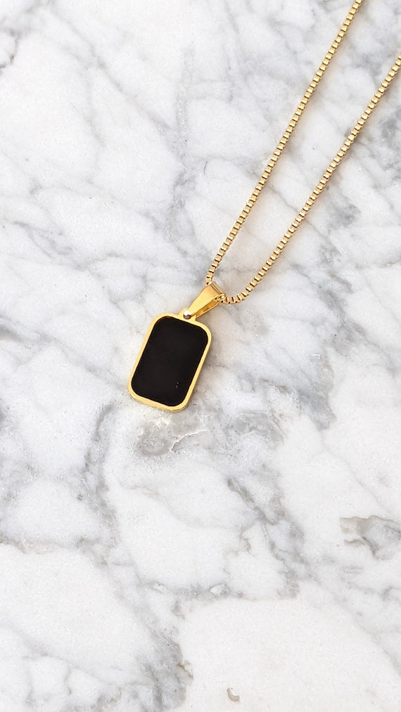 Unisex double sided iconic pendant